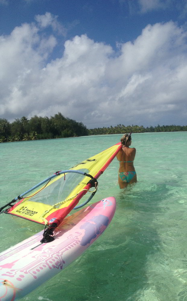Windsurf the crystal clear waters around Motu Moie, private island for sale