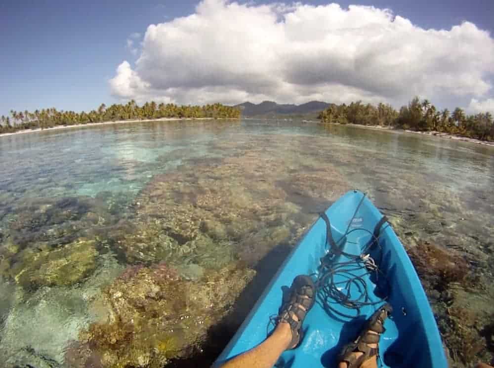 kayak over the coral heads in the waters surrounding Motu Moie in Tahiti